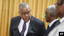 New Haitian Prime Minister Garry Conille, left, speaks to the president of the council Edgard Leblanc Fils during his swearing-in ceremony in Port-au-Prince, Haiti, June 3, 2024.