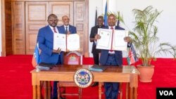 Seremoni siyati ako bilateral ant Ayiti ak Kenya pou otorizasyon fos miltinasyonal pou ede PNH la jere zak vyolans gang yo, nan Nairobi, kapital Kenya, 29 Fevriye, 2024. 