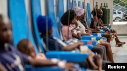 Patients receive treatment for cholera at the Gheskio Center Hospital supported by UNICEF in Port-au-Prince, Haiti, Oct. 14, 2022.