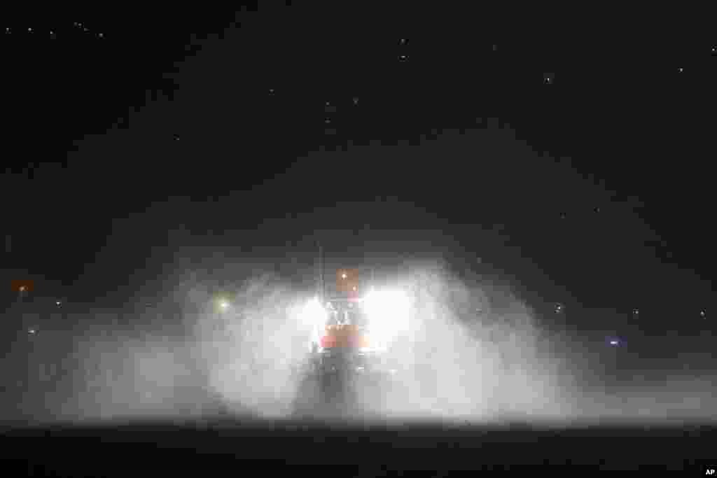 A fishing boat endures heavy rain and strong winds moored at the port in Horta, in the Portuguese island of Faial. Hurricane Lorenzo is lashing the mid-Atlantic Azores Islands with heavy rain, powerful winds and high waves.