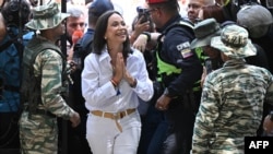 Venezuelan opposition leader Maria Corina Machado arrives at a polling station during the presidential election, in Caracas on July 28, 2024.