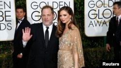 Nhà sản xuất phim Harvey Weinstein và vợ, nhà thiết kế thời trang Georgina Chapman.