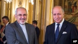 Ngoại trưởng Pháp Laurent Fabius (phải) và Ngoại trưởng Iran Jawad Zarif