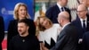 European Council President Charles Michel, 2nd right, talks to Italy's Prime Minister Giorgia Meloni, center, Ukraine's President Volodymyr Zelenskyy, bottom left, as they arrive for a group photo during an EU summit in Brussels, Oct. 17, 2024. 