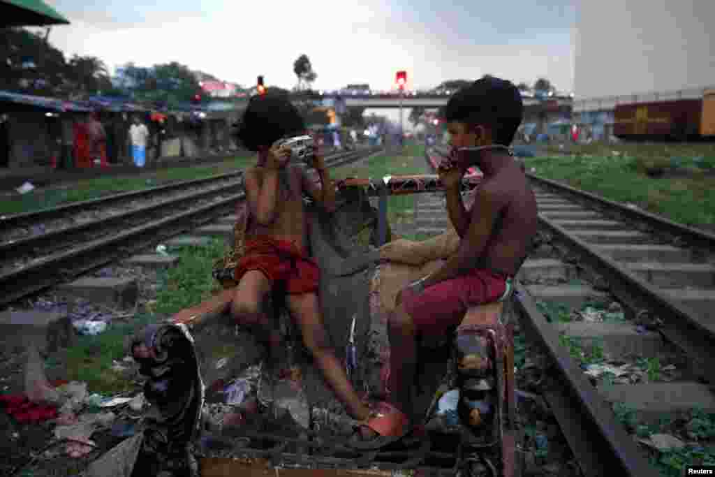 Children act out with a non-functioning camera in Dhaka, Bangladesh, Sept. 16, 2019.