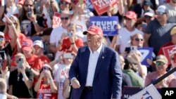 Republican presidential nominee former President Donald Trump shouts after speaking at a campaign event at Wilmington International Airport in Wilmington, N.C., Sept. 21, 2024. 