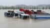 Trucks and vehicles are seen in floodwaters from heavy rains caused by Typhoon Mitag in Gangneung, South Korea.