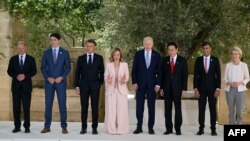 From left, German Chancellor Olaf Scholz, Canadian Prime Minister Justin Trudeau, French President Emmanuel Macron, Italy's Prime Minister Giorgia Meloni, US President Joe Biden, Japanese Prime Minister Fumio Kishida, British Prime Minister Rishi Sunak po