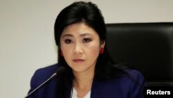 Thủ tướng Thái Lan Yingluck Shinawatra đang đối mặt với việc có thể bị cách chức .