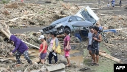 Bão Trami gây ra nhiều thiệt hại ở Laurel, tỉnh Batangas, phía nam Manila hôm 25/10/2024 (Photo: Ted ALJIBE / AFP). 