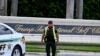 A Sherrif block the street outside the Trump International Golf Club in West Palm Beach, Florida, on September 15, 2024 following a shooting incident at former US president Donald Trump's golf course.