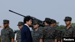 Taiwanese President Lai Ching-te visits a military base in response to recent Chinese military drills, in Taoyuan