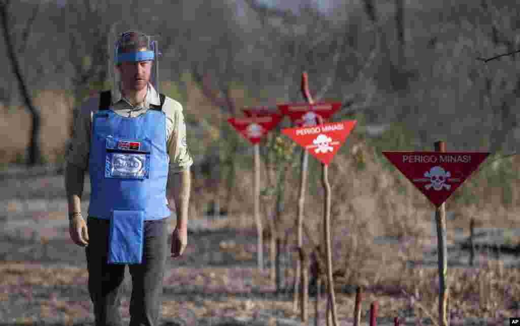 Britain&#39;s Prince Harry walks through a minefield in Dirico, Angola, during a visit to see the work of landmine clearance charity the Halo Trust, on day five of the royal tour of Africa. 