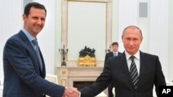 Tổng thống Syria Bashar al-Assad và Tổng thống Nga Vladimir Putin tại Điện Kremlin ở Moscow, ngày 20/10/2015.