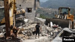 Aftermath of an Israeli strike on residential buildings in the Lebanese village Maaysrah, north of Beirut