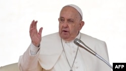 Pope Francis blesses the crowd during the weekly general audience on September 25, 2024 at St Peter's square in The Vatican. (Photo by Tiziana FABI / AFP)