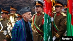 Tổng thống Afghanistan Hamid Karzai đến lễ khai mạc năm thứ tư của Quốc hội Afghanistan ở Kabul, 15/3/2014