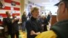 Democratic candidate Congresswoman Tammy Baldwin (C), who is running US Senate seat, meets with supporters at the North Shore Obama for America office in Glendale, Wisconsin, October 31, 2012. REUTERS/Darren Hauck (UNITED STATES - Tags: POLITICS ELECTIONS